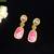 Elegant oval drop earrings with triple gemstone design