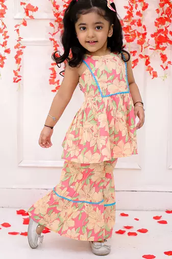Pink printed cotton kurti and sharara with bow-clip for girls
