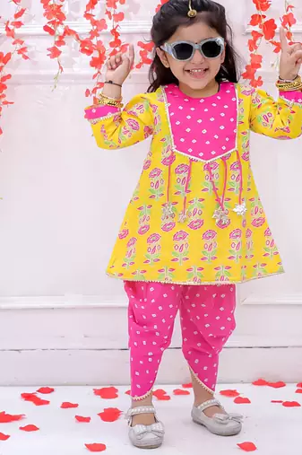 Yellow printed cotton peplum kurti and dhoti for girls
