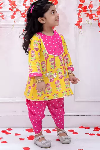 Yellow printed cotton peplum kurti and dhoti for girls