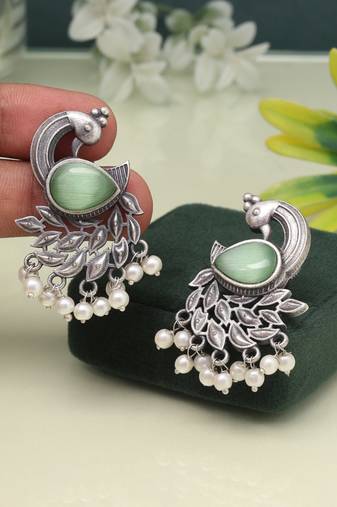 Pista green color oxidised earrings in bold and artistic finish