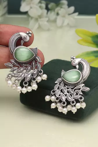 Pista green color oxidised earrings in bold and artistic finish