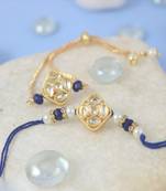 Gold-plated set of 2 handmade unisex rakhi for bhaiya bhabhi with roli chawal and written greeting note.