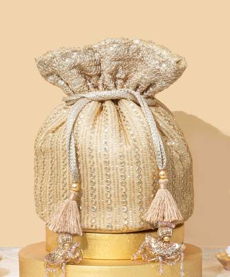 Beige silk embroidered potli bag 1