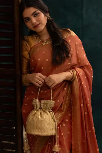 Beige silk embroidered potli bag