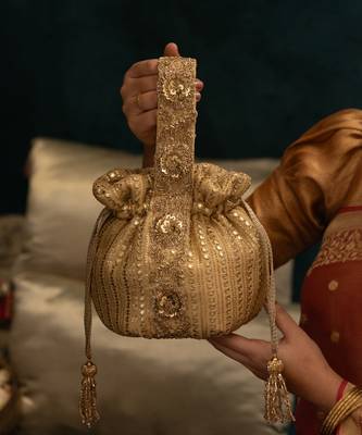 Gold silk embroidered potli bag 1
