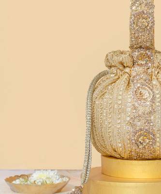 Gold silk embroidered potli bag 3