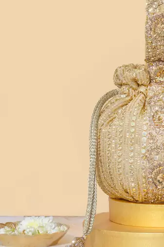Gold silk embroidered potli bag