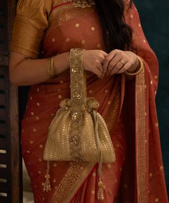 Gold silk embroidered potli bag 1