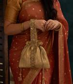 Gold silk embroidered potli bag