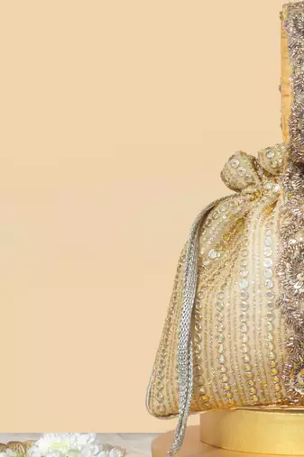 Gold silk embroidered potli bag