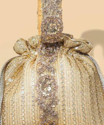 Gold silk embroidered potli bag 4
