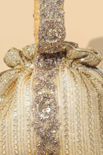 Gold silk embroidered potli bag