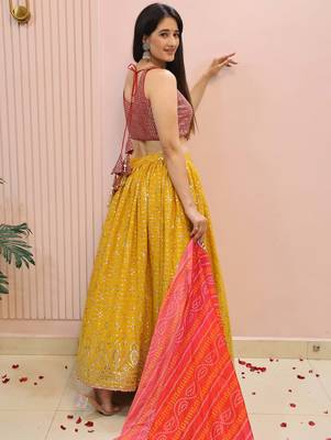 yellow zari work georgette haldi lehenga with blouse 4
