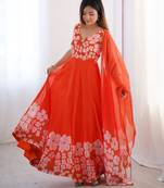 orange floral organza gown with handwork and matching dupatta