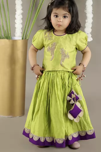 Green  cotton silk embroidered girls gharara paired with blouse