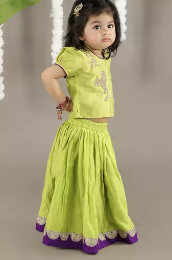 Green  cotton silk embroidered girls gharara paired with blouse