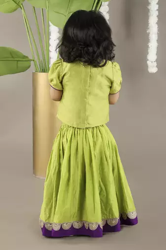 Green  cotton silk embroidered girls gharara paired with blouse
