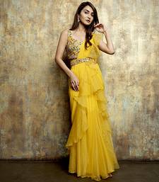 Yellow organza plain saree with embroidered blouse & belt