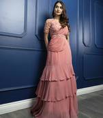 Pink georgette plain saree with embroidered blouse & belt