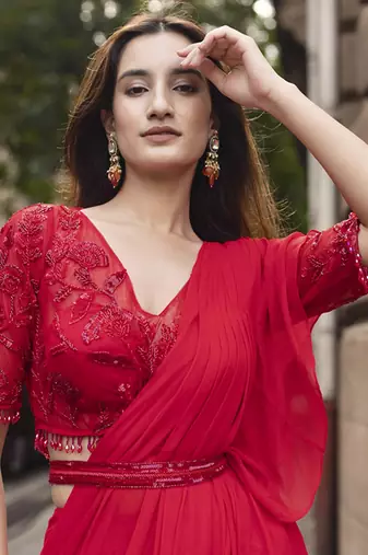 Red georgette plain saree with embroidered blouse & belt