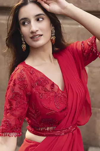 Red georgette plain saree with embroidered blouse & belt