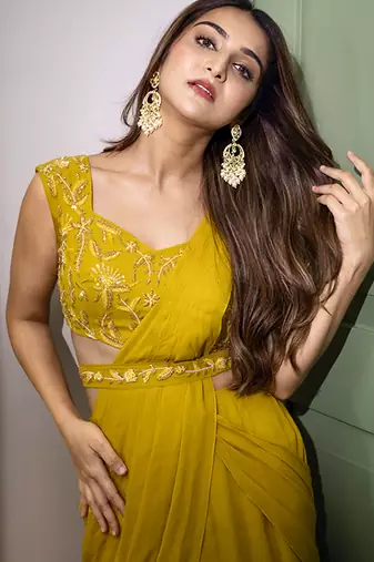 Yellow organza plain saree with embroidered blouse & belt