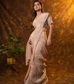 Beige tissue plain saree with embroidered blouse & belt