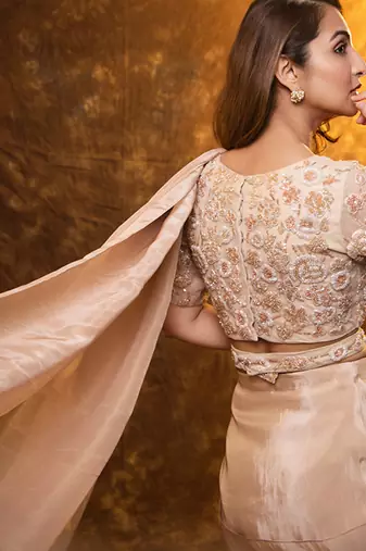 Beige tissue plain saree with embroidered blouse & belt