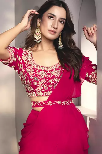 Pink georgette plain saree with embroidered blouse & belt