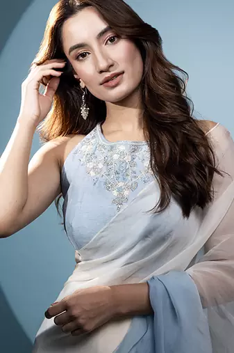 Light blue organza plain saree with embroidered blouse & belt