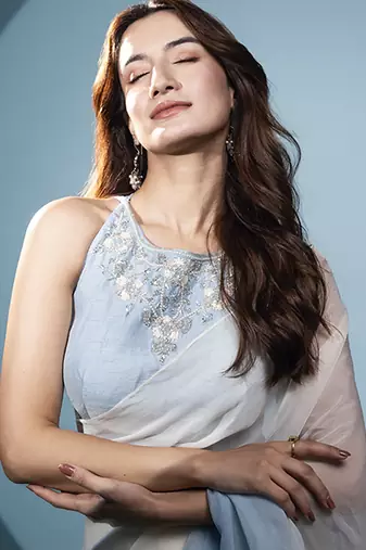 Light blue organza plain saree with embroidered blouse & belt