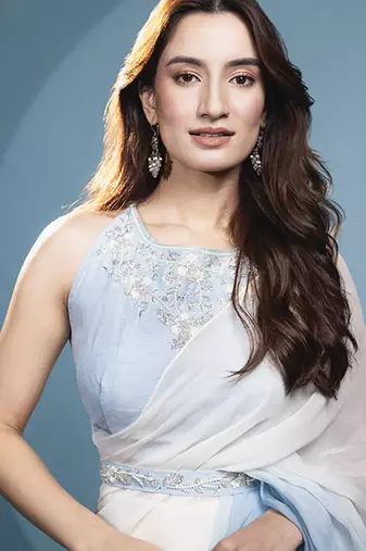 Light blue organza plain saree with embroidered blouse & belt