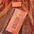 Women's orange handwork dress material