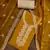 Women's mustard embroidered work dress material