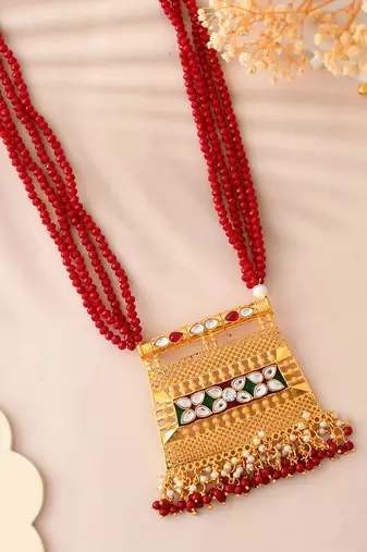 traditional red beaded necklace with kundan gold pendant for women