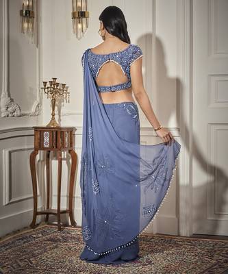 Blue georgette plain saree with embroidered blouse 5