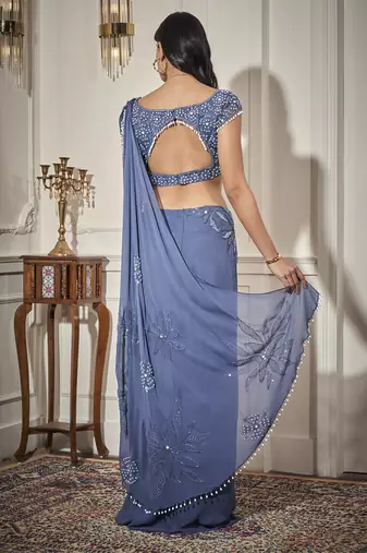 Blue georgette plain saree with embroidered blouse