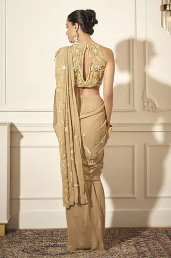 Gold georgette embroidered saree with blouse