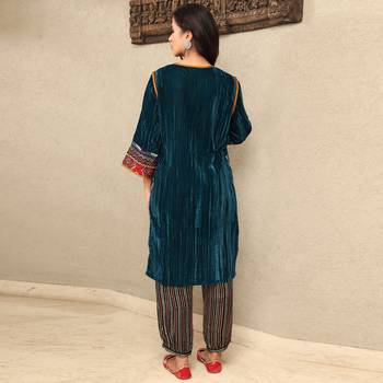 Teal crushed embroidered velvet kurta set with stripe modal silk harem pants 3