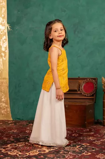 Girls moonga mirror work yellow cotton ethnic sleeveless strap top with off-white palazzo (set of 2)