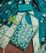 teal blue jacquard salwar suit with heavy embroidery and rich dupatta