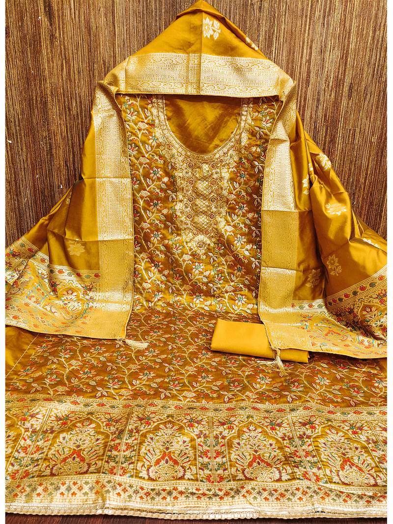 golden jacquard salwar suit with heavy embroidery and rich dupatta