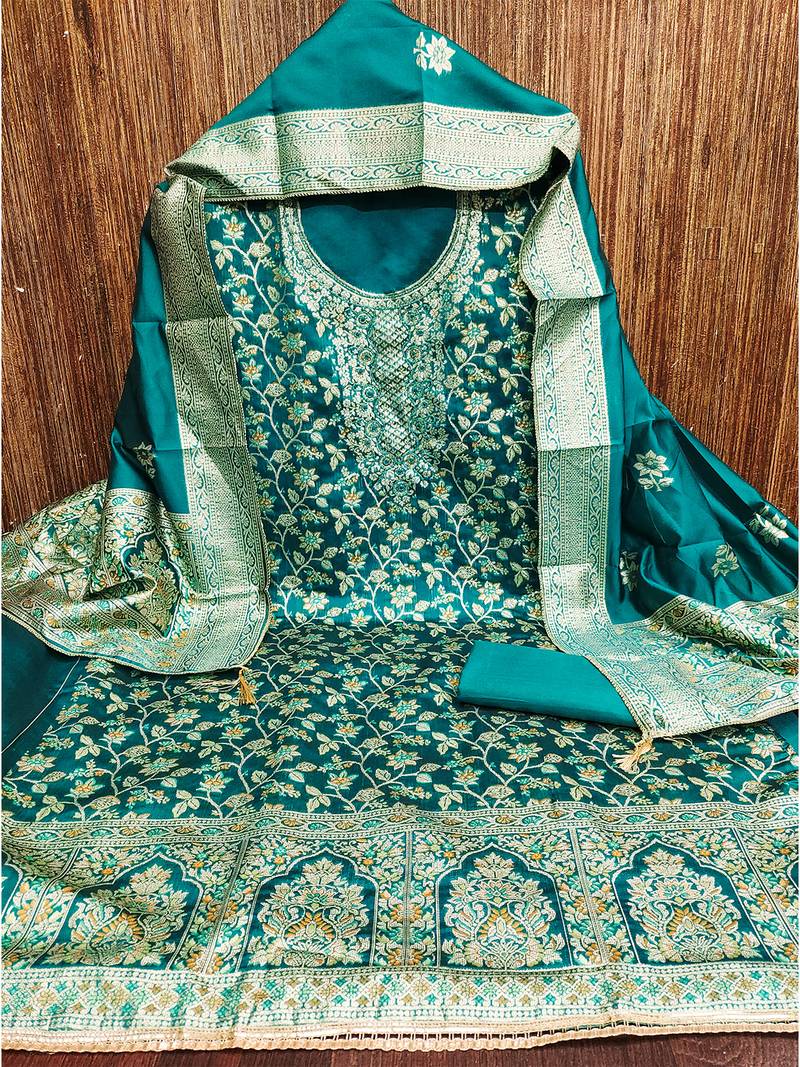 Elegant teal blue jacquard salwar suit with heavy embroidery and rich dupatta