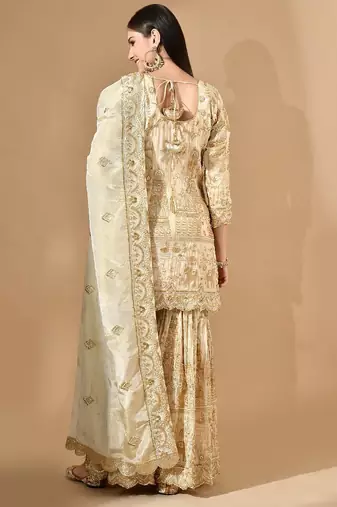 Golden sharara set with zardozi pearl & cutdana work