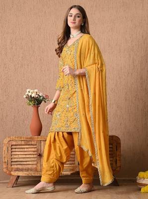 Traditional yellow kurta set with zardozi dabka sequins and tilla work 1