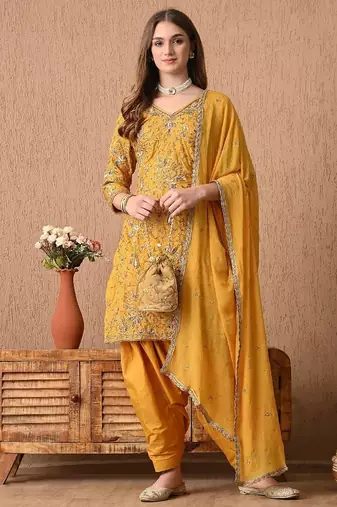 Traditional yellow kurta set with zardozi dabka sequins and tilla work