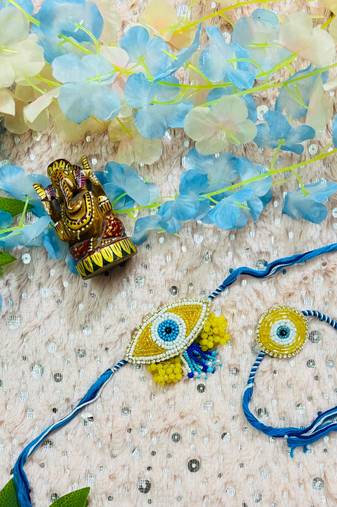 Blue Evil Eye Bhaiya Bhabhi Rakhi Set with Bead Work & Yellow Floral Accents