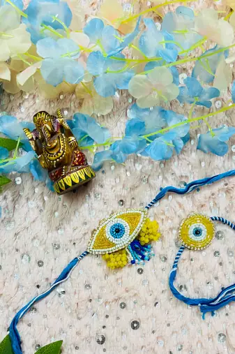 Blue Evil Eye Bhaiya Bhabhi Rakhi Set with Bead Work & Yellow Floral Accents