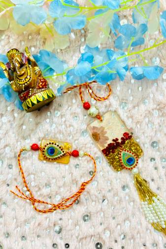 Peacock Eye Bhaiya Bhabhi Rakhi Set with Resin Floral Charm and Beaded Tassel